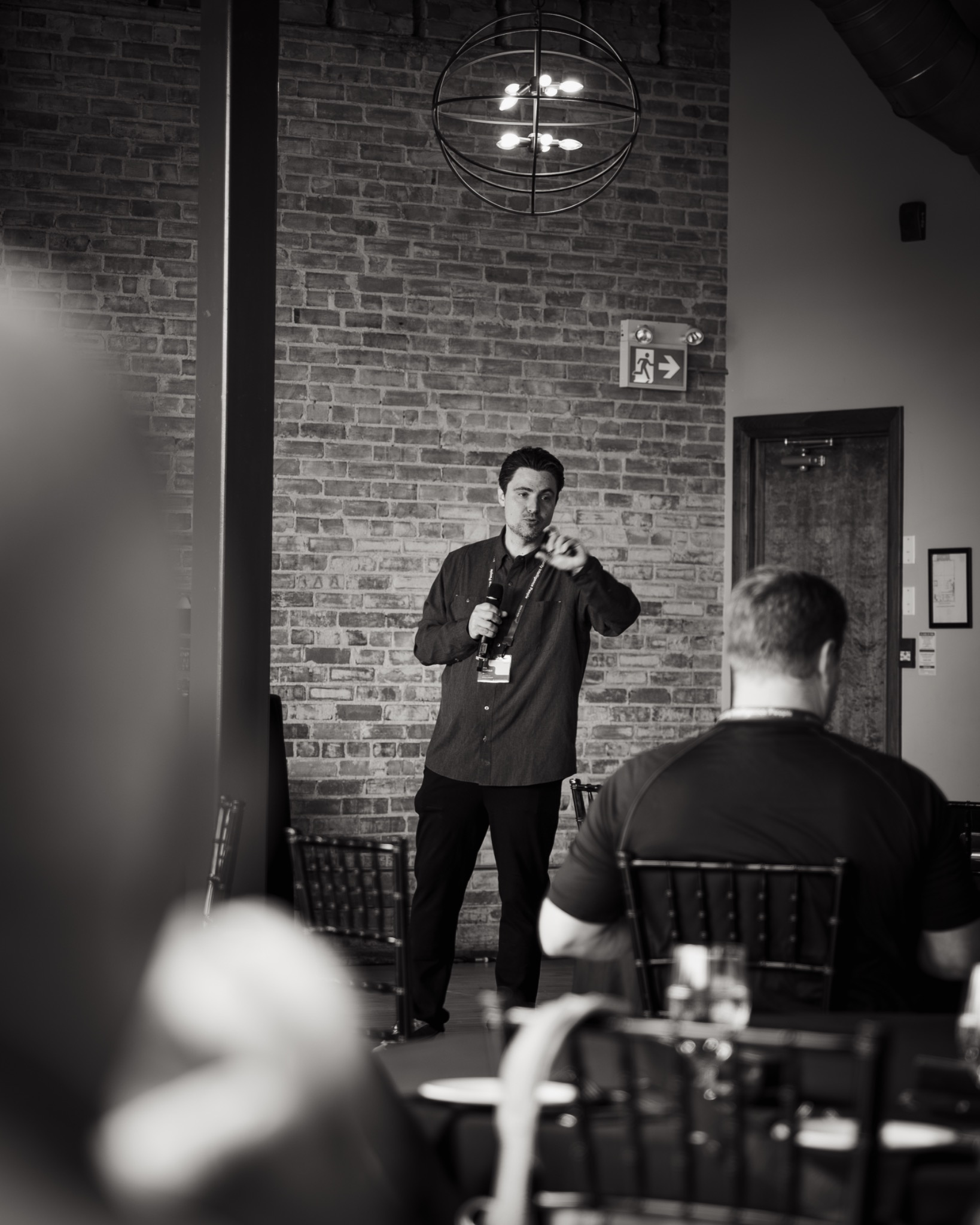 Phil Coppola speaking to an audience at an event